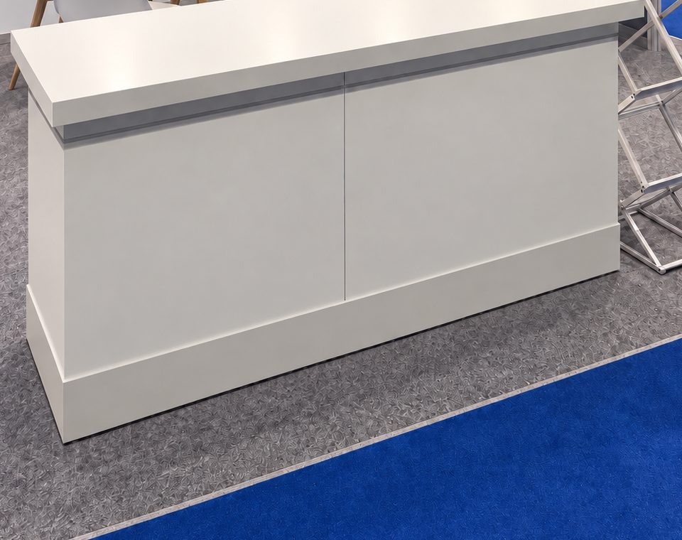 White reception counter on an exhibition stand
