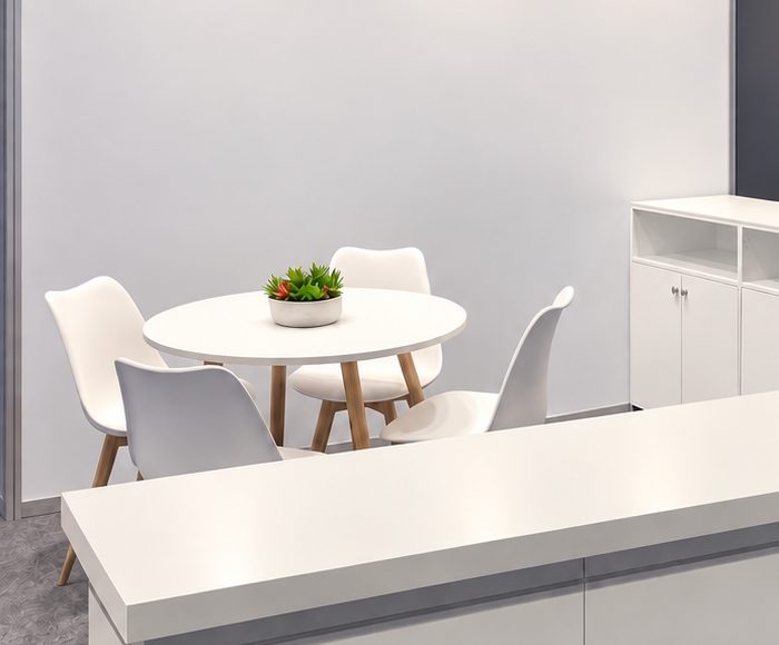 White round meeting table with four chairs